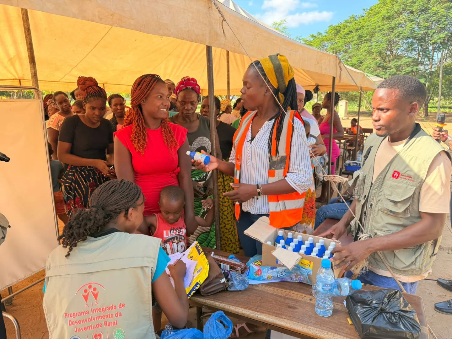 AJA volunteers explaining the use of CERTEZA water purifiers